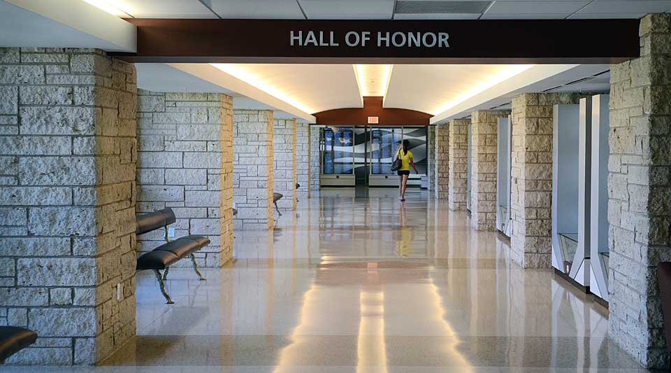 MSC Hall of Honor with the list of Aggies lost in service in the background.